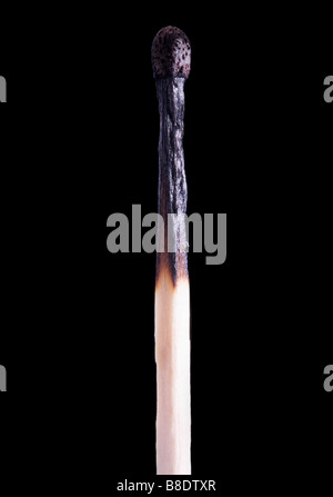 BURNT MATCHSTICK - BLACK BACKGROUND Stock Photo