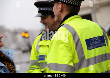 Brighton and Hove community support officers chat to a member of the public whilst out on the beat Stock Photo