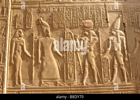 Reliefs and hieroglyphics at Kom Ombo Temple, Egypt (two brothers, god Horus, before Ptolemy VIII and his wife, Cleopatra) Stock Photo