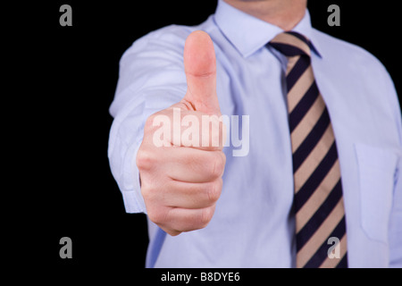 businessman gesture with his thumb up isolated on black Stock Photo