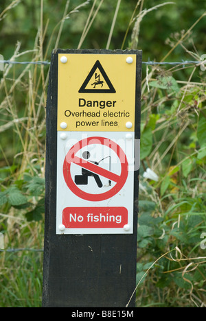 No Fishing Danger overhead electric power lines sign Stock Photo