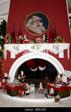 Santa Coming Down the Chimney & Various Christmas Decorations Stock Photo