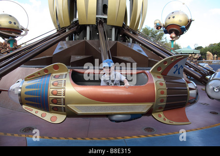 Young boy in rocket ride at Disneyland California Stock Photo