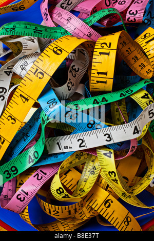 Pile of colorful measuring tapes Stock Photo