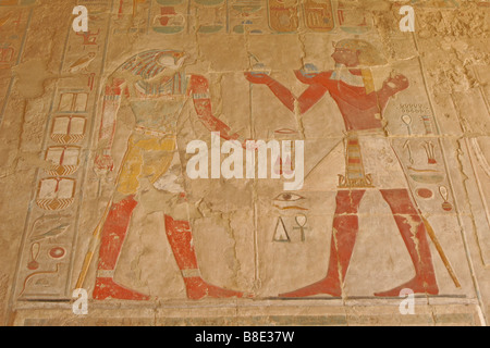 Painted reliefs at Deir al-Bahri, West Bank, Luxor, Egypt Stock Photo