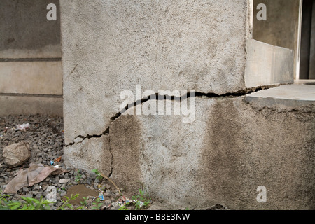 Subsidence and cracking in an Indian house foundation in Hazira village. Hazira, near Surat, Gujarat. India. Stock Photo