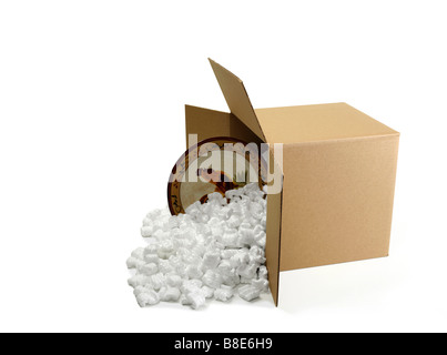 Open Cardboard Shipping Box with dinner Plate Stock Photo