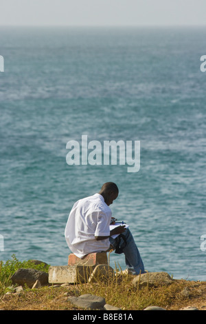 Young Senegalese Man Studying on the Coast in Dakar Senegal Stock Photo