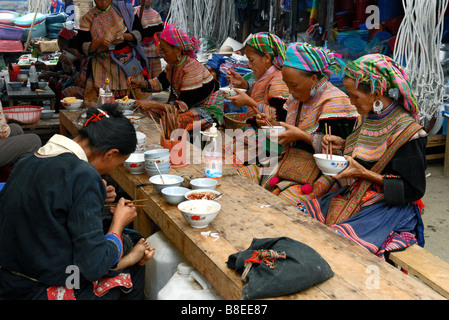 Flower Hmong people eating in Bac Ha village Vietnam Stock Photo