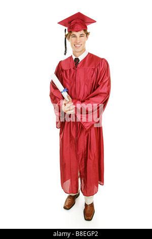 Handsome young graduate in his cap and gown holding his diploma Full body isolated on white Stock Photo