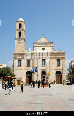 The church in the main square of the lovely town of Chania on the west coast of the Island of Crete with its pretty harbour. Stock Photo