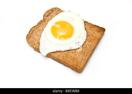 Fried egg on toast isolated on a white studio background Stock Photo