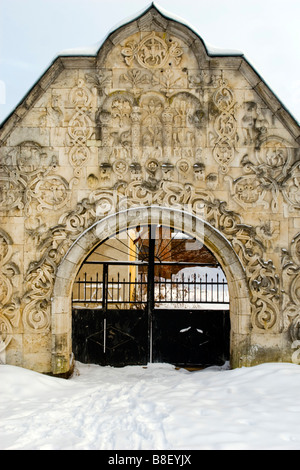 Old monasterium gateway closed in winter time. Stock Photo