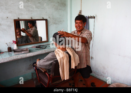 Barber open air shop My Tho, South Vietnam Stock Photo