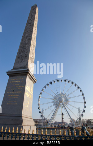 The Luxor Obelisk and La Grande Roue Ferris Wheel in Place de la Concorde, Paris Stock Photo