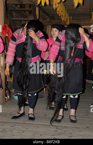 Yao women undoing their long hair Longsheng Guangxi China Stock Photo