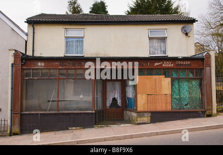 Boarded up shop in a run down state Blaenavon Torfaen South Wales Stock Photo