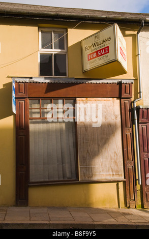 Boarded up windows of shop for sale in Blaenavon Torfaen South Wales UK Stock Photo