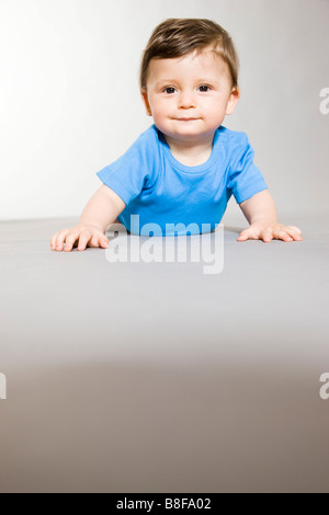 baby boy crawling on the floor Stock Photo