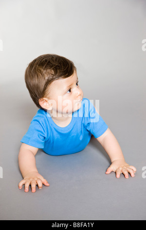 baby boy crawling on the floor Stock Photo