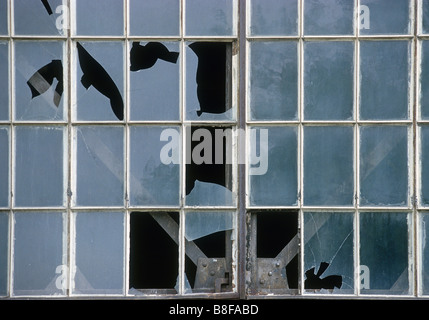 Old factory window, partially broken Stock Photo