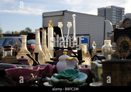 Secondhand and antique goods on sale early in the morning at a car boot sale or market in London, England. Stock Photo