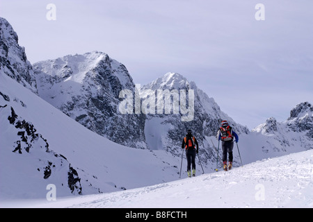 Tour alp skiers in Velka Studna dolina valley High Tatras Slovakia Stock Photo