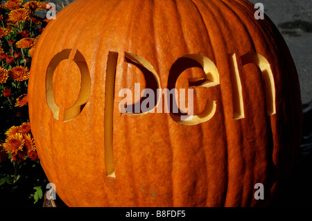 A pumpkin with the word Open carved in it Stock Photo
