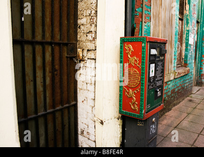 Parking meter decorated with Chinese emblems in the Chinatown district of Liverpool UK Stock Photo