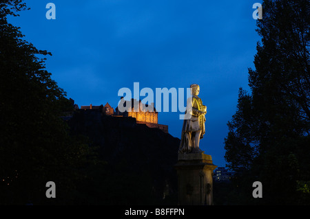Illuminated Allan Ramsay Statue with Edinburgh Castle in background ...