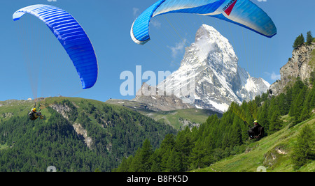 View of the The Matterhorn mountain peak with paraglider , Zermatt , Swiss Alps Stock Photo