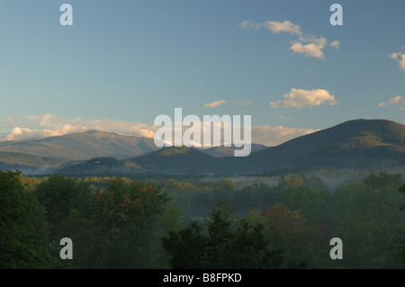Mount Washington 6 288 ft seen from Intervale NH during sunrise with fog lying in the valley Stock Photo
