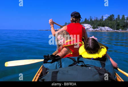 Family canoe tripping on lake superior Stock Photo