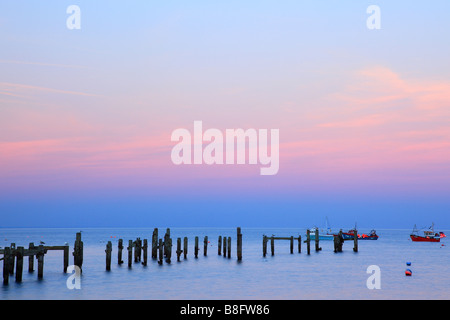 Old pier at sunset in Swanage Dorset England Stock Photo