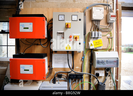 WIND TURBINE CONTROL BOX AND GRID INVERTERS IN AN ENERGY EFFICIENT HOME UK Stock Photo