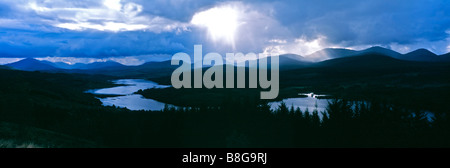 A panoramic view of a moody threatening sunset over Glen Garry in Scotland Stock Photo