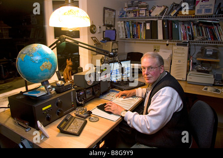 Ham radio operator in his radio shack located in Shelton Washington USA MR Stock Photo