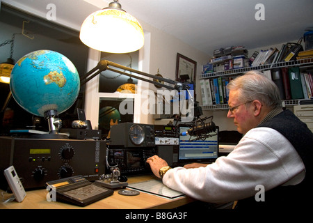 Ham radio operator in his radio shack located in Shelton Washington USA Stock Photo