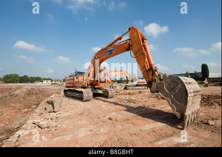 Orange Doosan DX340 tracked excavator working on a building site in england Stock Photo