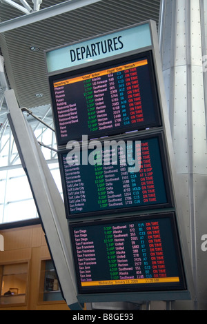 Airline departure notice board at the Portland International Airport in Portland Oregon USA Stock Photo