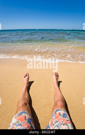 Legs and feet on a beach Haena Beach Kauai Hawaii Stock Photo - Alamy