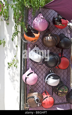 'Designer' crash helmets on stall at 'Hippie Market' Sant Carles , Ibiza. Stock Photo