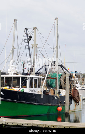 Gillnet fishing boat docked at pier on overcast day Sandwich Cape Cod USA Stock Photo