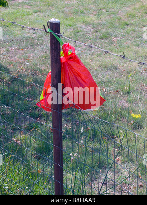Pouch on the fence Stock Photo