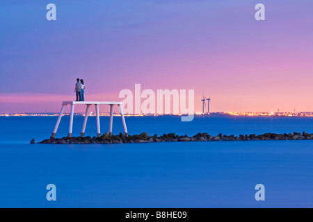 The Couple a sculpture installed off the coast of Newbiggin by the Sea by the artist and sculptor Sean Henry Stock Photo