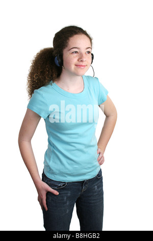 A cute teen girl modeling a blue t shirt and wearing headphones The t shirt is blank ready for logo Stock Photo