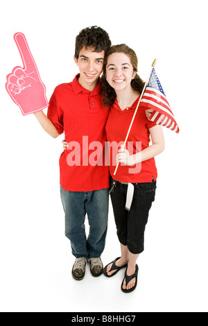 Attractive teen couple supporting their favorite sports team or political party Full body isolated on white Stock Photo