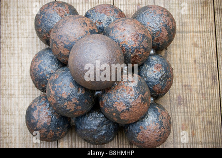 Pile of old cannon balls High angle shot Stock Photo