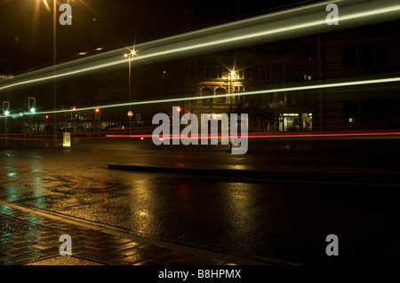 Creating light traces through long exposure Stock Photo