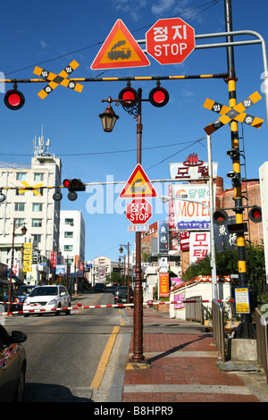 steet scene in   Busan  (Pusan)  in  South Korea, a goods transportation train is passing by Stock Photo